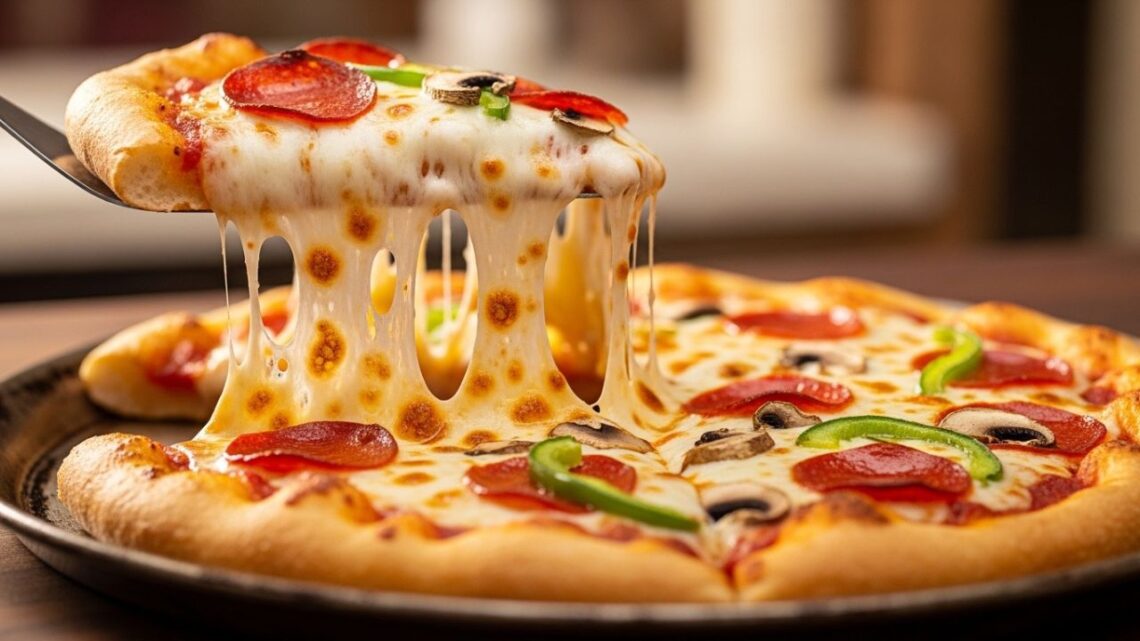 Golden pizza slice with stretching cheese